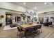 Spacious living room with open floor plan, dining area, and modern decor and hardwood floors at 33667 N 71St Way, Scottsdale, AZ 85266