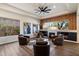Comfortable living room with fireplace, artwork, and a large window offering scenic views at 33667 N 71St Way, Scottsdale, AZ 85266