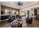 Charming living room featuring a fireplace, cozy seating, and a view of the outdoor space at 33667 N 71St Way, Scottsdale, AZ 85266