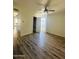 Spacious bedroom with modern wood flooring, a ceiling fan, and ample closet space at 3828 N 32Nd St # 213, Phoenix, AZ 85018
