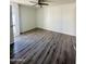 Bright bedroom with a ceiling fan and modern wood flooring at 3828 N 32Nd St # 213, Phoenix, AZ 85018