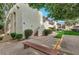 Cozy condo community featuring stucco exterior, staircase access, mature trees and a wooden bench at 3828 N 32Nd St # 213, Phoenix, AZ 85018
