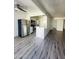 Open kitchen and living area with stainless steel appliances and modern flooring at 3828 N 32Nd St # 213, Phoenix, AZ 85018
