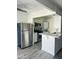 Modern kitchen featuring stainless steel appliances and a bar area at 3828 N 32Nd St # 213, Phoenix, AZ 85018