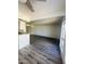 Open living space with modern wood flooring and natural light from a large window at 3828 N 32Nd St # 213, Phoenix, AZ 85018