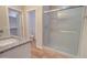 Modern bathroom with a granite countertop vanity, framed shower and tile flooring at 3850 N Mateo Dr, Eloy, AZ 85131