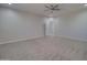 Neutral bedroom featuring a ceiling fan, carpet flooring, and a doorway leading to an adjacent room at 3850 N Mateo Dr, Eloy, AZ 85131