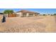 Inviting single-story home featuring a three-car garage, block perimeter fence and low maintenance landscape at 3850 N Mateo Dr, Eloy, AZ 85131