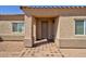 Covered front entry to a desert home featuring a low maintenance landscape and paver walkway at 3850 N Mateo Dr, Eloy, AZ 85131