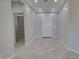 Open hallway featuring tile floors, recessed lighting and a white door at 3850 N Mateo Dr, Eloy, AZ 85131