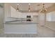 Kitchen featuring white cabinets, stainless steel appliances and granite countertops at 3850 N Mateo Dr, Eloy, AZ 85131