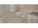 Convenient laundry room includes counter space, storage cabinets and utility sink at 3850 N Mateo Dr, Eloy, AZ 85131