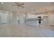 Open concept living space and kitchen featuring tile floors, recessed lighting, and white cabinets at 3850 N Mateo Dr, Eloy, AZ 85131