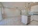 Bright, open-concept space with sleek flooring flowing from the kitchen to the living area at 3850 N Mateo Dr, Eloy, AZ 85131