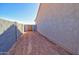Side yard featuring a private entry through the decorative metal gate at 3850 N Mateo Dr, Eloy, AZ 85131