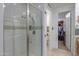 Modern bathroom featuring a glass shower with a sleek design and a walk-in closet at 3855 S Mcqueen Rd # 12, Chandler, AZ 85286