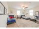 Spacious bedroom with two beds, bright windows, and a ceiling fan for added comfort at 3855 S Mcqueen Rd # 12, Chandler, AZ 85286