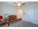Comfortable bedroom with a rocking chair, dresser, and a glimpse into the hallway at 3855 S Mcqueen Rd # 12, Chandler, AZ 85286