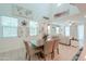 Bright dining area with a wooden table, views of the living room, and high ceilings for lots of light at 3855 S Mcqueen Rd # 12, Chandler, AZ 85286