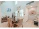 Elegant dining area with a wooden table, comfortable chairs, and soaring ceilings for ample light at 3855 S Mcqueen Rd # 12, Chandler, AZ 85286