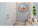 Inviting front foyer with neutral paint, a stylish mirror, and a charming welcome bench at 3855 S Mcqueen Rd # 12, Chandler, AZ 85286