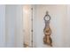 Inviting hallway featuring a decorative clock and a glimpse into another room at 3855 S Mcqueen Rd # 12, Chandler, AZ 85286