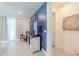Cozy living room with a large TV, accent wall, and neutral curtains at 3855 S Mcqueen Rd # 12, Chandler, AZ 85286