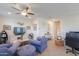 Stylish loft area featuring comfortable seating, a modern ceiling fan, and a functional workspace at 3855 S Mcqueen Rd # 12, Chandler, AZ 85286