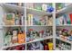 Well-stocked pantry filled with various food items and household supplies on white shelves at 3855 S Mcqueen Rd # 12, Chandler, AZ 85286