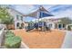 Community playground with modern equipment and a soft mulch surface, great for Gathering fun at 3855 S Mcqueen Rd # 12, Chandler, AZ 85286