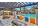 Community pool area featuring lounge chairs, grilling area and shade structures for resident relaxation at 3855 S Mcqueen Rd # 12, Chandler, AZ 85286