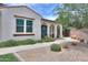 Rear exterior showcasing arched covered patios and desert landscaping in a tranquil outdoor setting at 3855 S Mcqueen Rd # 12, Chandler, AZ 85286