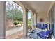 Relaxing rear patio featuring desert landscaping and a shaded seating area, perfect for outdoor enjoyment at 3855 S Mcqueen Rd # 12, Chandler, AZ 85286