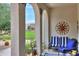 Charming rear patio offers relaxed outdoor seating area with views of the green space at 3855 S Mcqueen Rd # 12, Chandler, AZ 85286