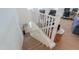 Staircase with white railings leading to an open loft area with office setups and comfortable seating at 3855 S Mcqueen Rd # 12, Chandler, AZ 85286