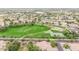 Aerial view of a community park featuring a basketball court, playground and large grassy area at 3875 E Claxton Ave, Gilbert, AZ 85297