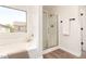 Bathroom with soaking tub, stand up shower, and view from window at 3875 E Claxton Ave, Gilbert, AZ 85297