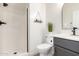Bright bathroom with a step-in shower, gray vanity, decor shelving, and neutral tones at 3875 E Claxton Ave, Gilbert, AZ 85297