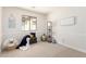 Bright bedroom with window, stylish decor, and plush carpeting at 3875 E Claxton Ave, Gilbert, AZ 85297