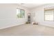 Spacious bedroom with two windows and neutral decor at 3875 E Claxton Ave, Gilbert, AZ 85297