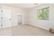 Bright bedroom featuring a window and a closet at 3875 E Claxton Ave, Gilbert, AZ 85297