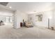 Spacious bonus room featuring neutral carpet, a comfortable chaise lounge, and natural light at 3875 E Claxton Ave, Gilbert, AZ 85297
