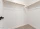 Walk-in closet featuring hanging rods at 3875 E Claxton Ave, Gilbert, AZ 85297