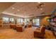 Cozy community center lounge featuring comfortable seating, bookshelves, and natural light for relaxing and socializing at 3875 E Claxton Ave, Gilbert, AZ 85297