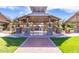Covered picnic area with stone columns and seating, ideal for community gatherings at 3875 E Claxton Ave, Gilbert, AZ 85297
