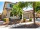 Charming two-story home with a well-manicured yard, neutral stucco, and a two-car garage at 3875 E Claxton Ave, Gilbert, AZ 85297