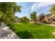 Well-maintained green space with manicured lawn, walking path, landscaping, and a picnic pavilion at 3875 E Claxton Ave, Gilbert, AZ 85297