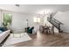 Inviting living room featuring hardwood floors and comfortable seating arrangement at 3875 E Claxton Ave, Gilbert, AZ 85297
