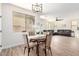 Open-concept living room with dining area and modern flooring at 3875 E Claxton Ave, Gilbert, AZ 85297