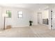 Open loft area with two windows and a staircase at 3875 E Claxton Ave, Gilbert, AZ 85297